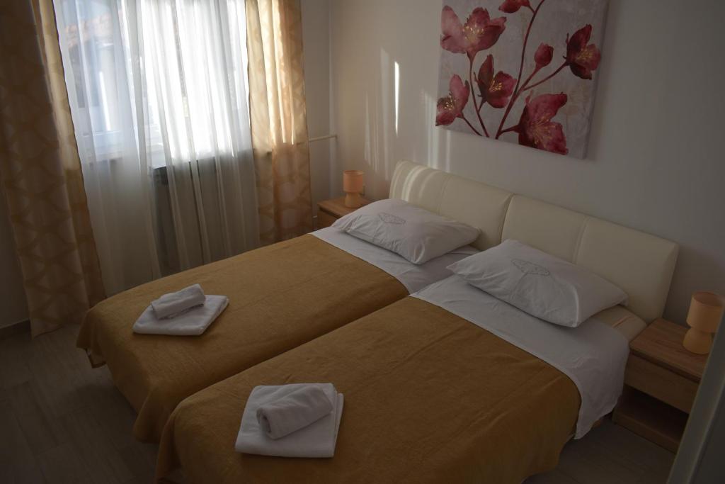 Postel nebo postele na pokoji v ubytování Korcula Apartments Iliskovic