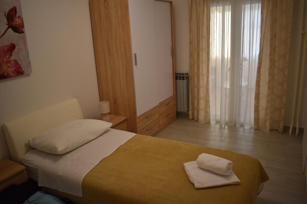 Postel nebo postele na pokoji v ubytování Korcula Apartments Iliskovic