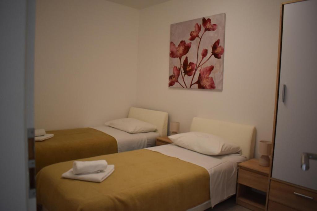Postel nebo postele na pokoji v ubytování Korcula Apartments Iliskovic