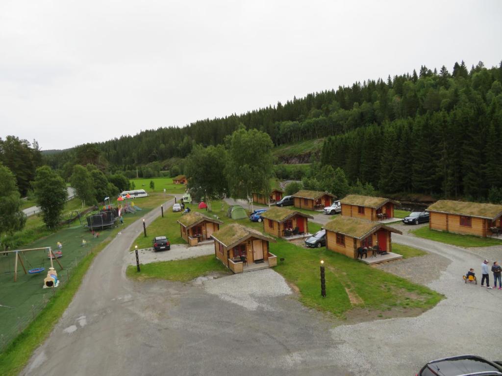 an aerial view of a village with a parking lot at Halland Camping in Berkåk