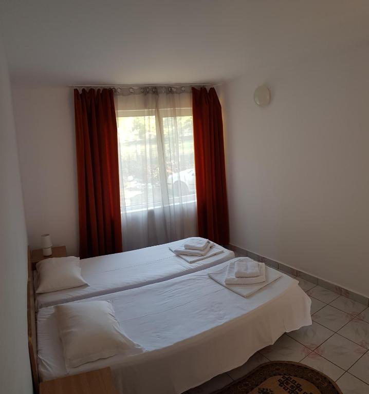 Voodi või voodid majutusasutuse Hotel Camelia toas