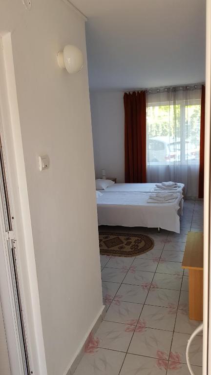 Voodi või voodid majutusasutuse Hotel Camelia toas