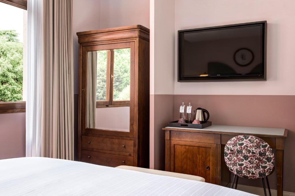 Postel nebo postele na pokoji v ubytování Hotel Indigo Verona - Grand Hotel Des Arts by IHG