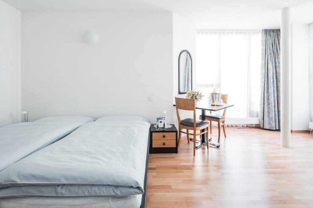 Postel nebo postele na pokoji v ubytování Raselli Sport Hotel