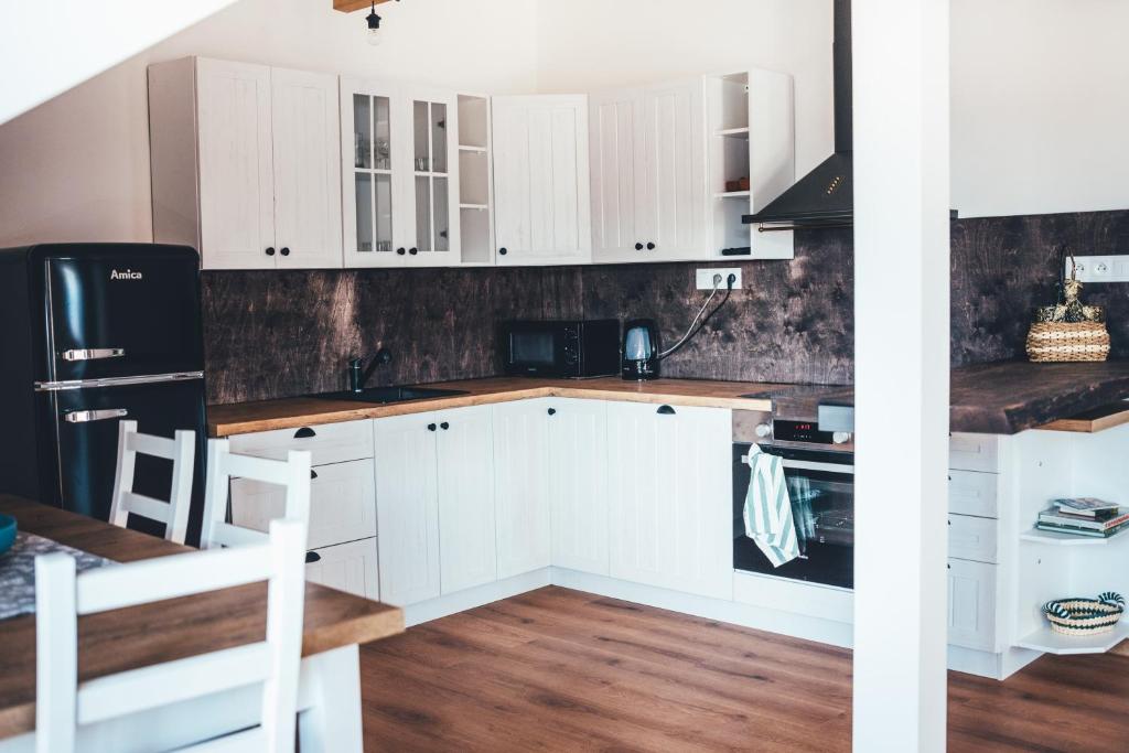 Kuchyň nebo kuchyňský kout v ubytování Apartmány na náměstí