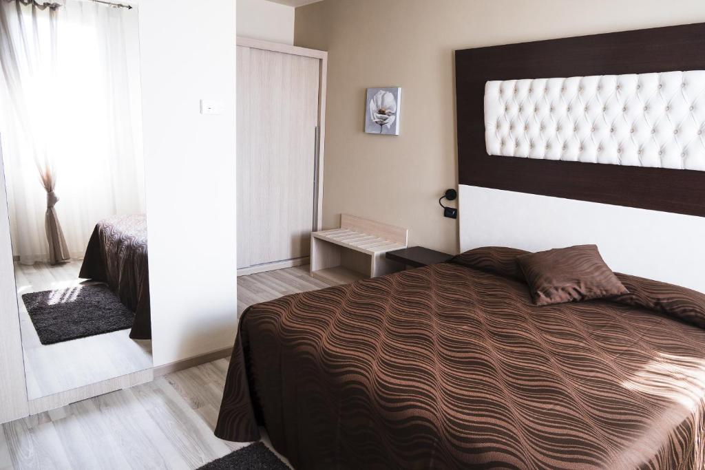 A bed or beds in a room at Agriturismo il Cascinale