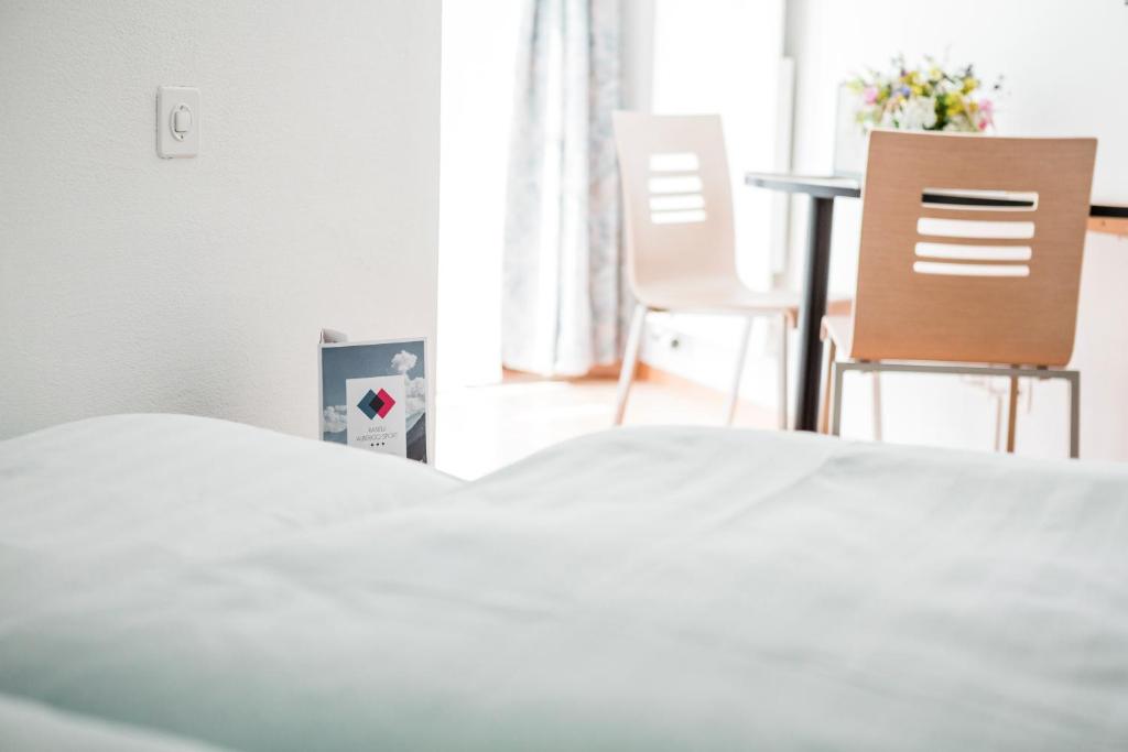 Postel nebo postele na pokoji v ubytování Raselli Sport Hotel