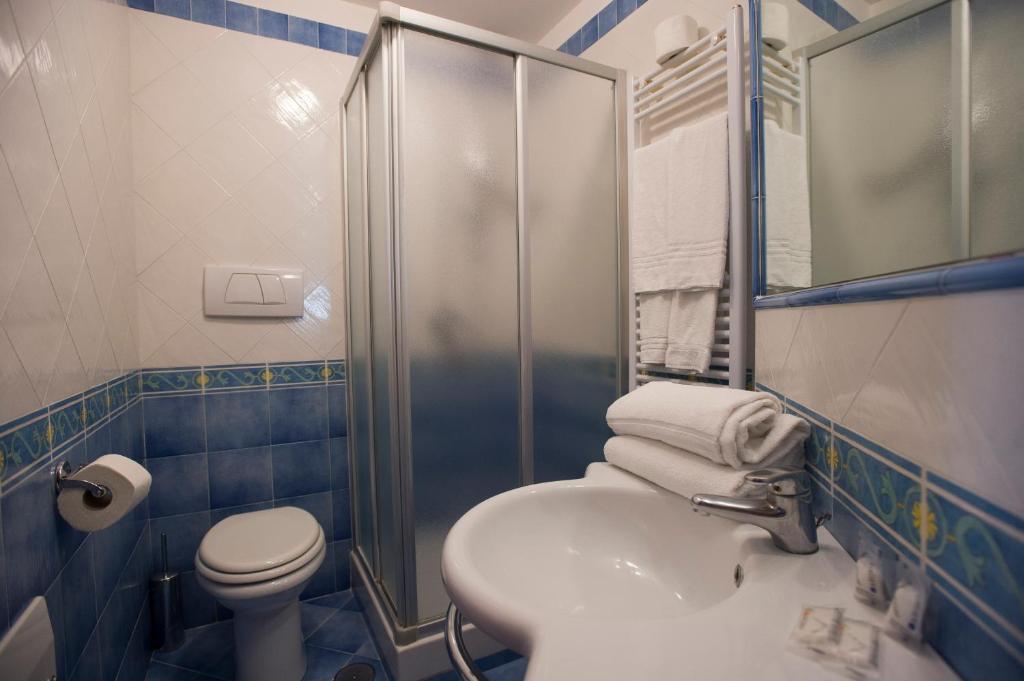 a bathroom with a sink and a toilet and a shower at Residence Panoramic in Maiori