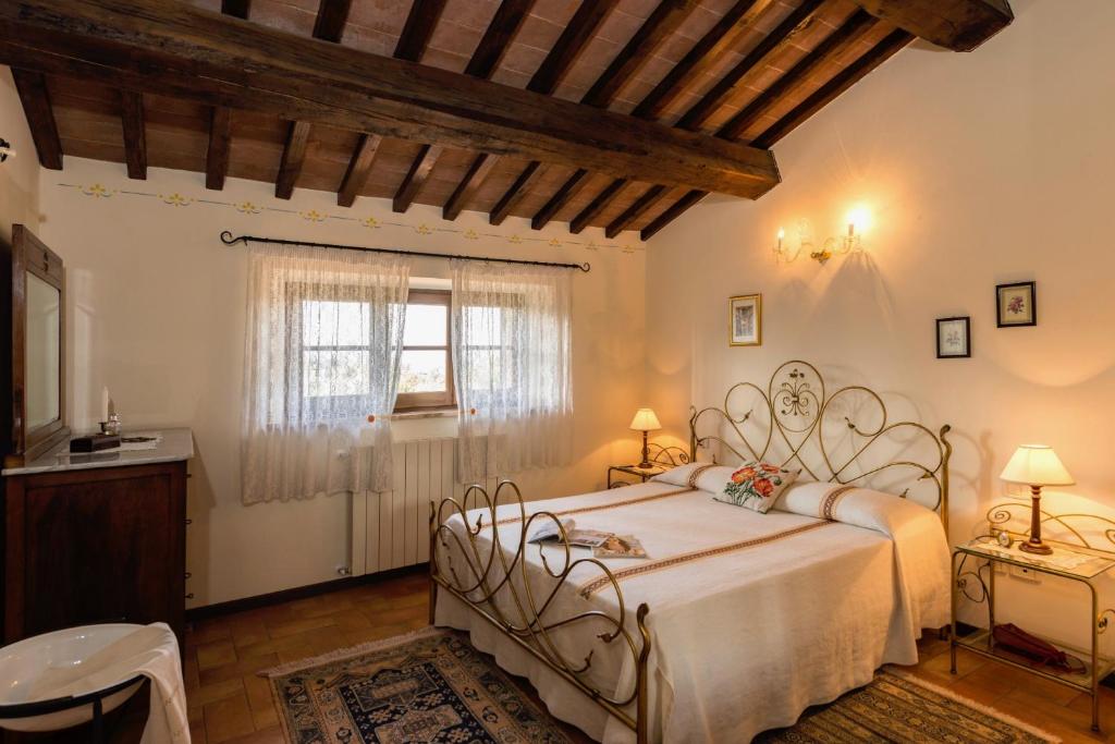 Postel nebo postele na pokoji v ubytování Agriturismo CaseGraziani
