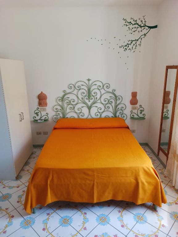 A bed or beds in a room at Filù Rooms Paradise Tower