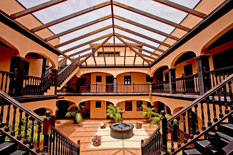 a large building with a glass ceiling with a fountain at RESIDENCIAL EL CONDE # 9 in Valle Gran Rey