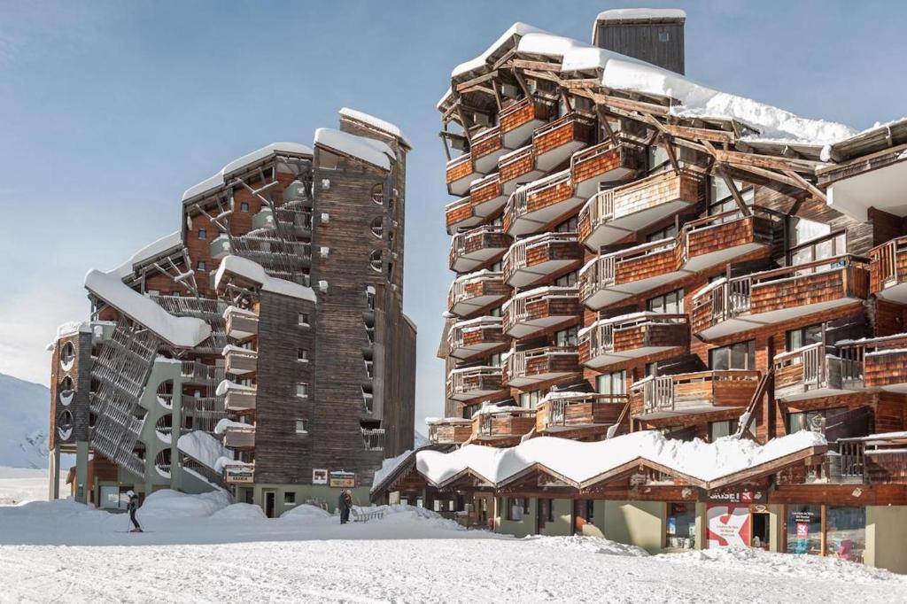 a large building in the snow with snow covered roofs at Résidence Saskia Falaise - Avoriaz in Morzine