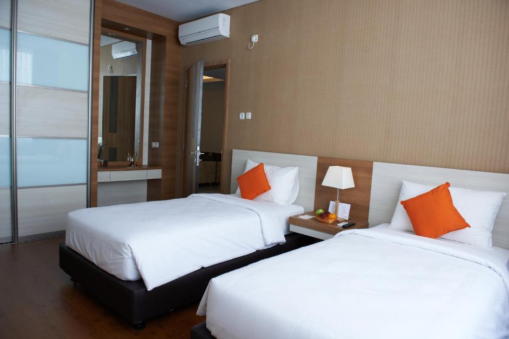 Postel nebo postele na pokoji v ubytování Winstar Hotel