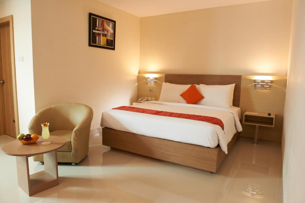 Postel nebo postele na pokoji v ubytování Winstar Hotel