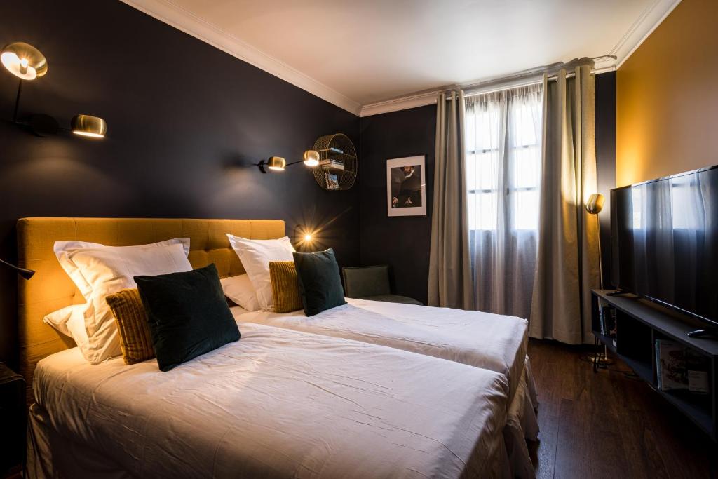 Postel nebo postele na pokoji v ubytování Hôtel - Restaurant Le Globe