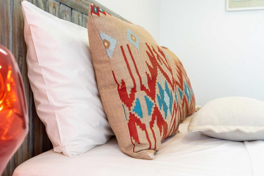 Postel nebo postele na pokoji v ubytování Mosso Boutique Hotel