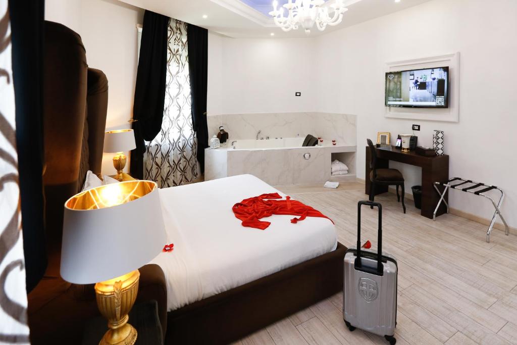 Postel nebo postele na pokoji v ubytování Escape Luxury Suite - CA Domus Collection