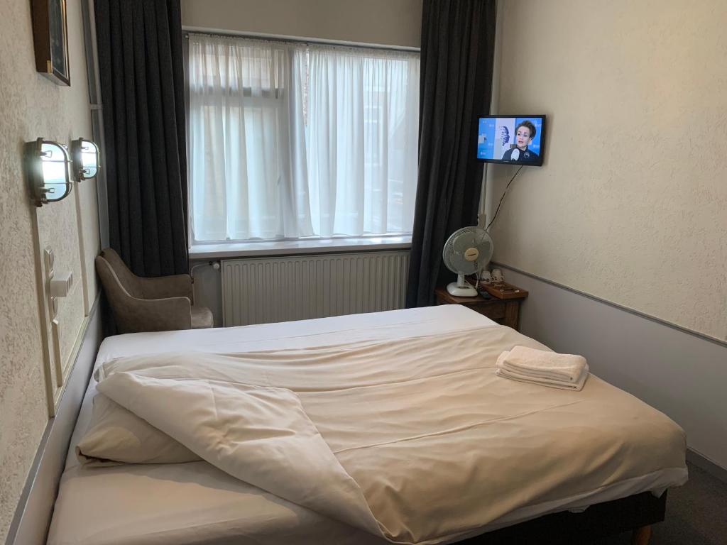 Postel nebo postele na pokoji v ubytování Amadeus Hotel