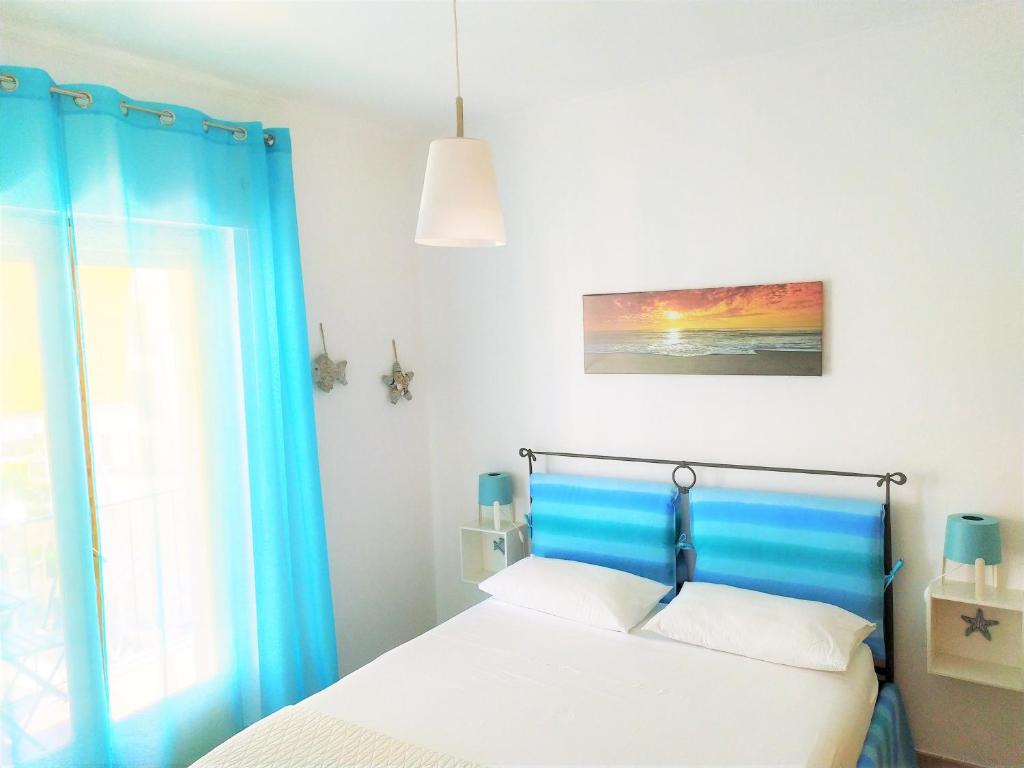 Postel nebo postele na pokoji v ubytování B&B Pizzomunno