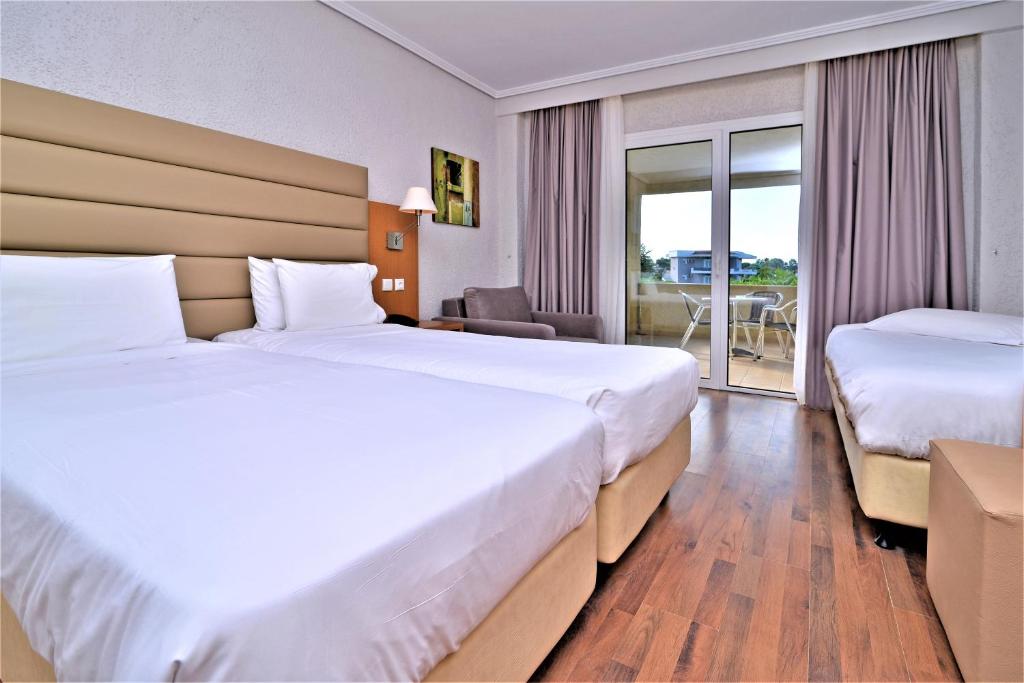 Postel nebo postele na pokoji v ubytování Poseidon Palace