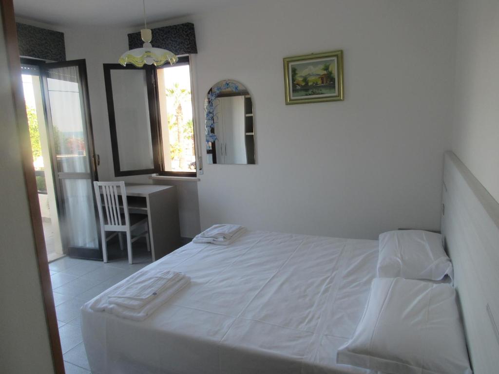 Postel nebo postele na pokoji v ubytování Hotel Alb's