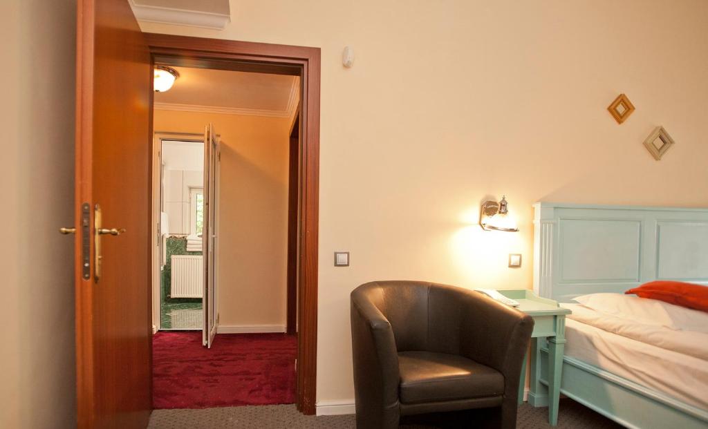 Postel nebo postele na pokoji v ubytování Hotel Bastion