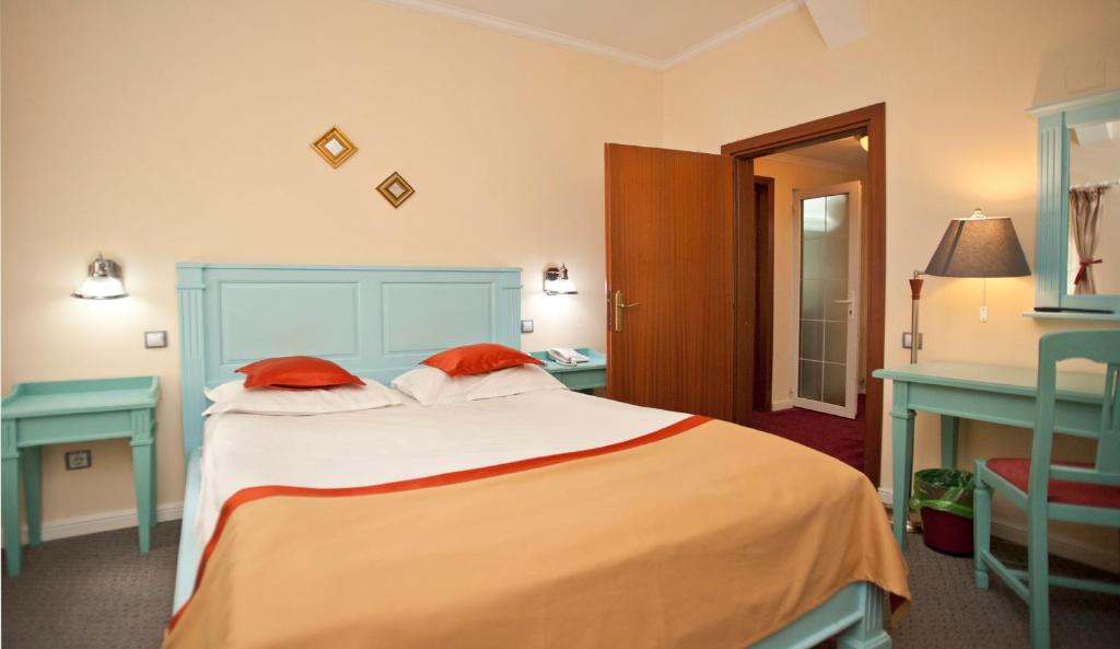 Postel nebo postele na pokoji v ubytování Hotel Bastion