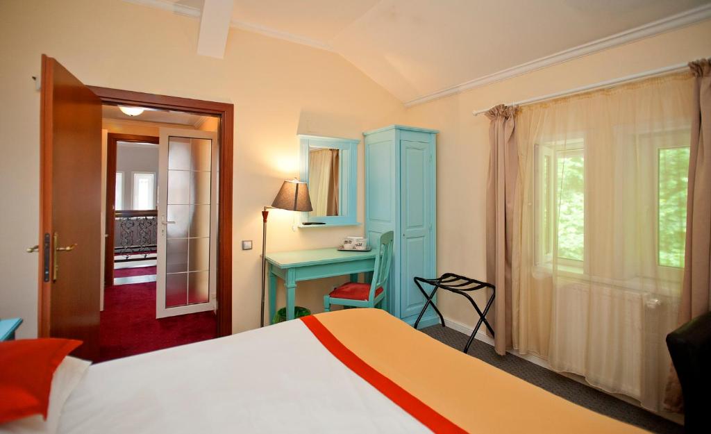 Postel nebo postele na pokoji v ubytování Hotel Bastion
