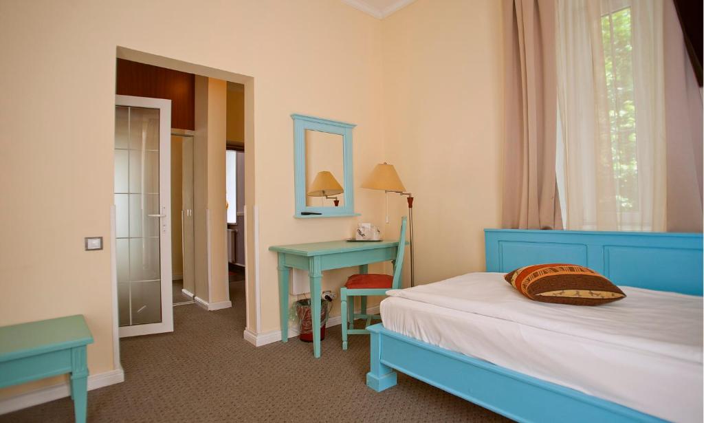 Postel nebo postele na pokoji v ubytování Hotel Bastion