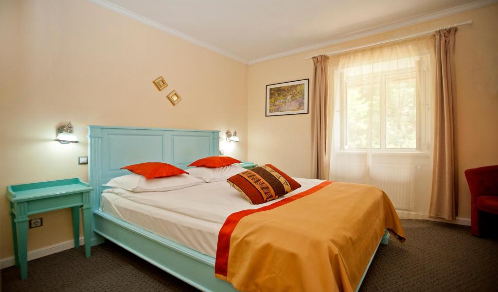 Postel nebo postele na pokoji v ubytování Hotel Bastion