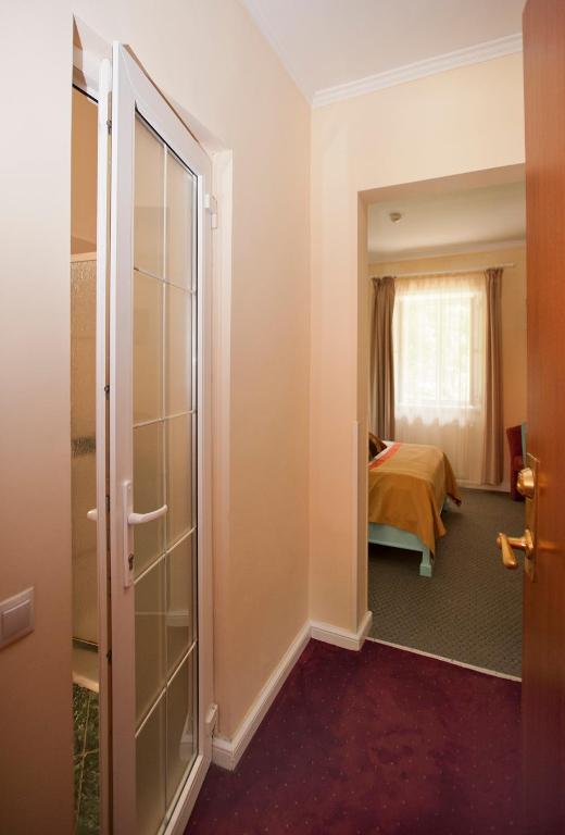 Postel nebo postele na pokoji v ubytování Hotel Bastion