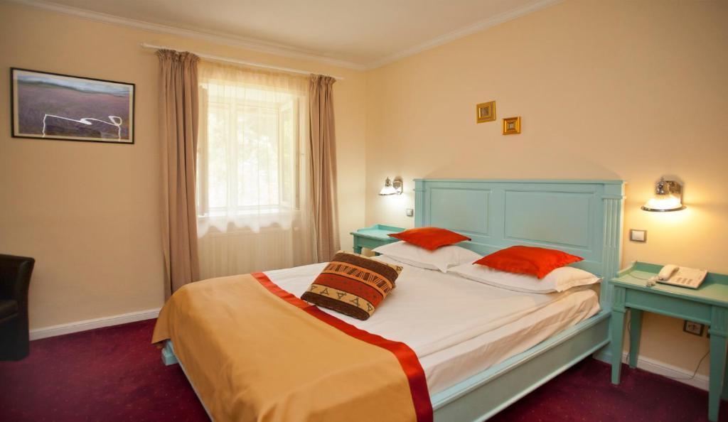 Postel nebo postele na pokoji v ubytování Hotel Bastion