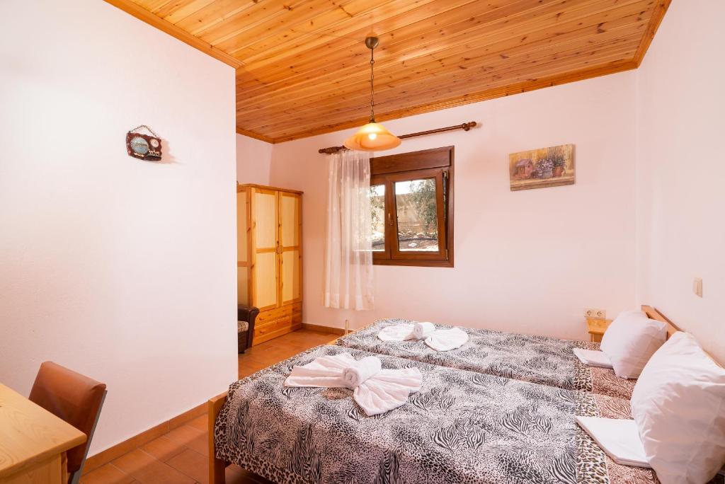 Postel nebo postele na pokoji v ubytování Archodissa Villa