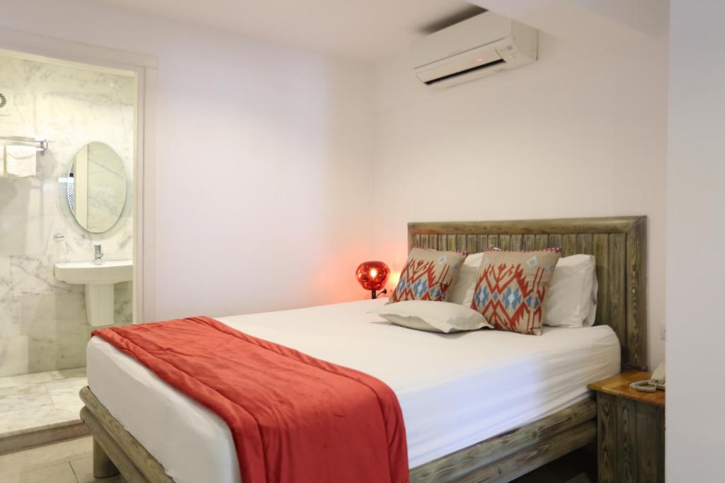 Postel nebo postele na pokoji v ubytování Mosso Boutique Hotel