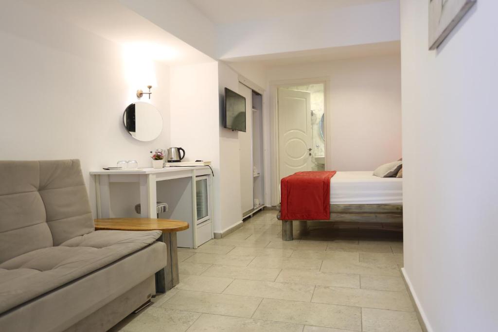 TV a/nebo společenská místnost v ubytování Mosso Boutique Hotel