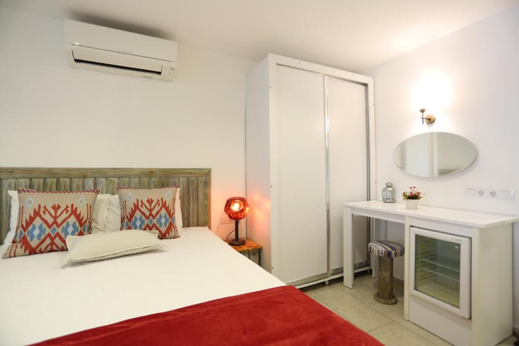 Postel nebo postele na pokoji v ubytování Mosso Boutique Hotel