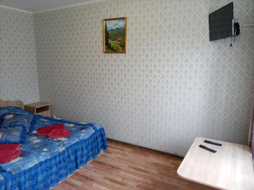 Ein Bett oder Betten in einem Zimmer der Unterkunft Guest House Ivanna