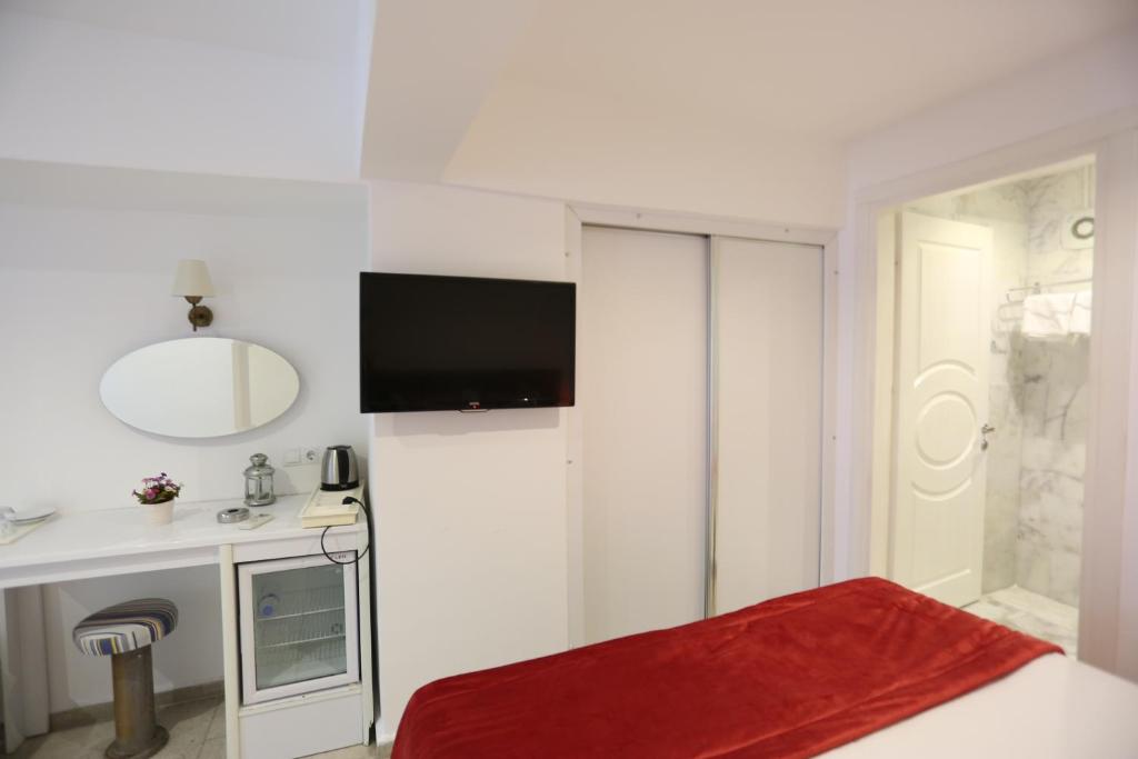 TV a/nebo společenská místnost v ubytování Mosso Boutique Hotel