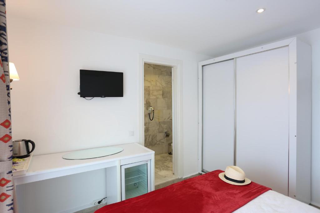 Postel nebo postele na pokoji v ubytování Mosso Boutique Hotel