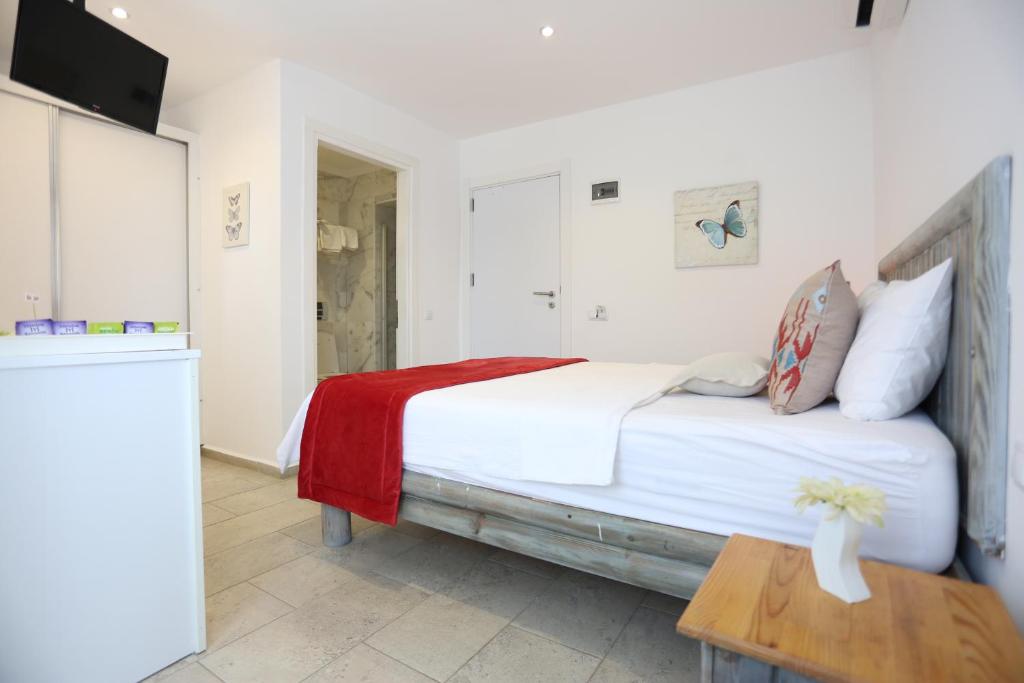 Postel nebo postele na pokoji v ubytování Mosso Boutique Hotel