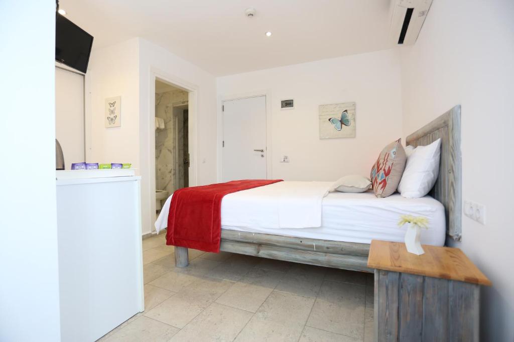 Postel nebo postele na pokoji v ubytování Mosso Boutique Hotel