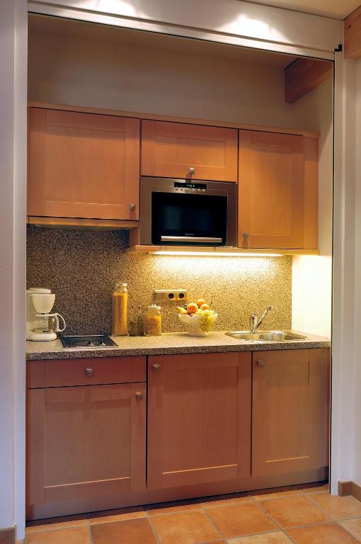 Kuchyň nebo kuchyňský kout v ubytování Apartments Hubertushof