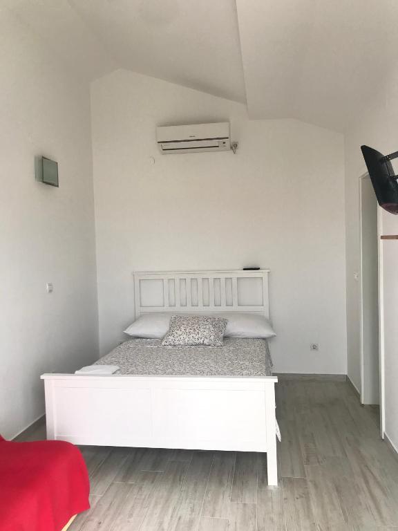 Postel nebo postele na pokoji v ubytování Guesthouse Davorka Bijelić