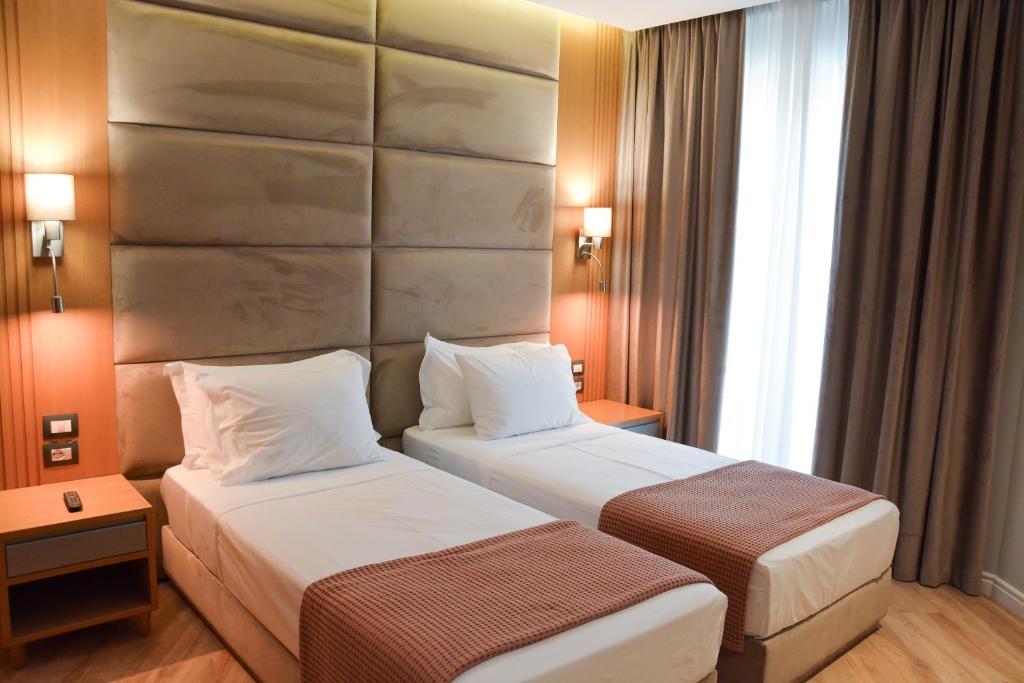 Postel nebo postele na pokoji v ubytování Sea View Hotel