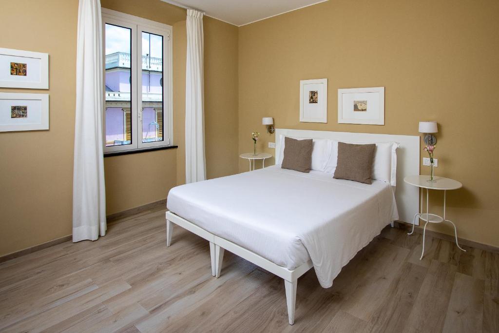 Postel nebo postele na pokoji v ubytování Blu Hotel