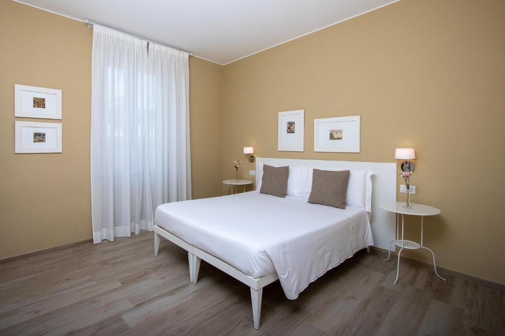 Postel nebo postele na pokoji v ubytování Blu Hotel