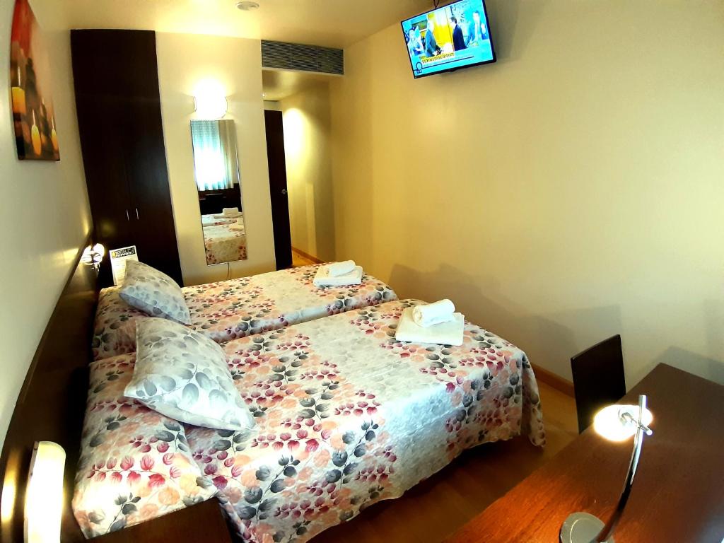 Postel nebo postele na pokoji v ubytování Hostal Nirvana