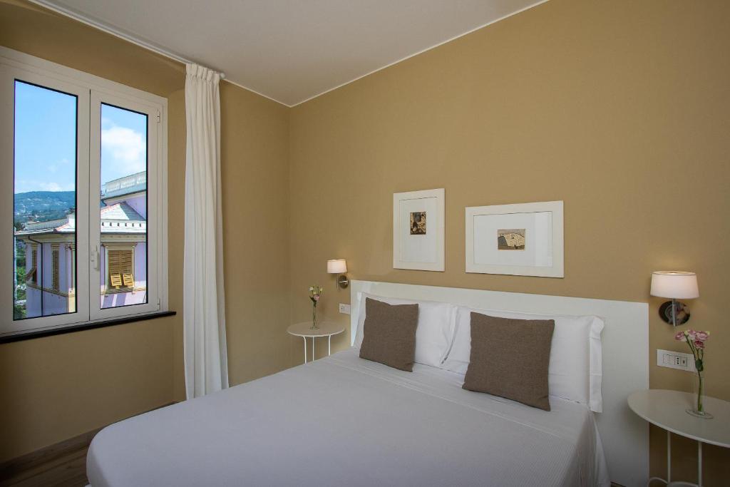 Postel nebo postele na pokoji v ubytování Blu Hotel