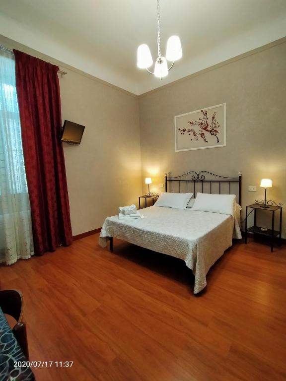 Postel nebo postele na pokoji v ubytování Rossi Hotel