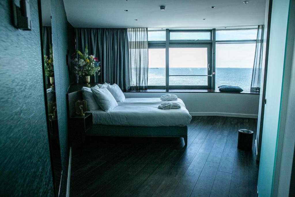 Postel nebo postele na pokoji v ubytování De Pier Suites